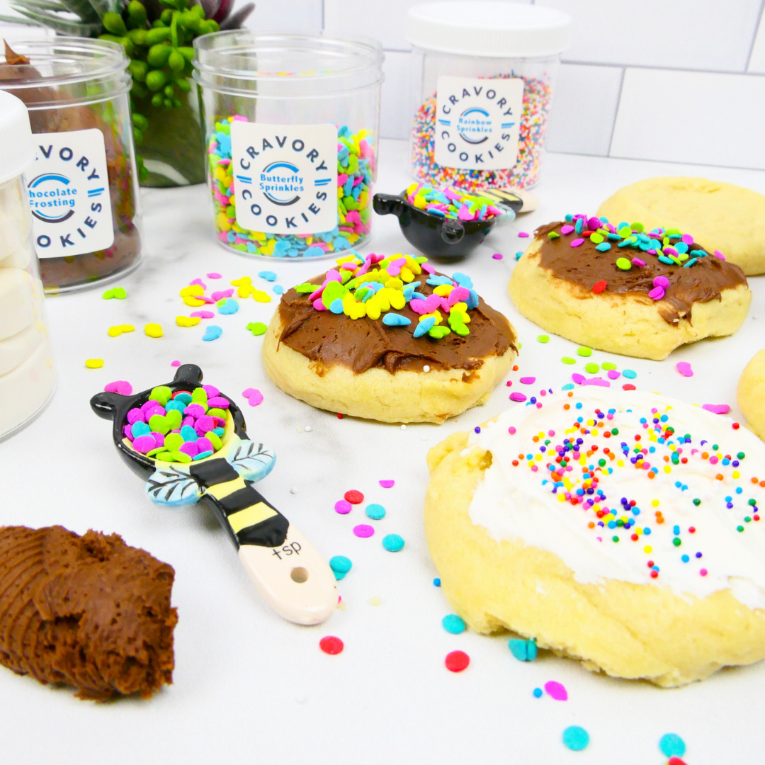 Decorating cookies with frosting and sprinkles