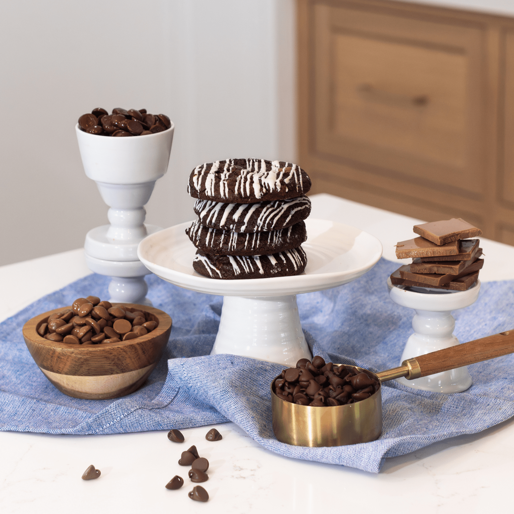 Stack of chocolate cookies and chocolate chips