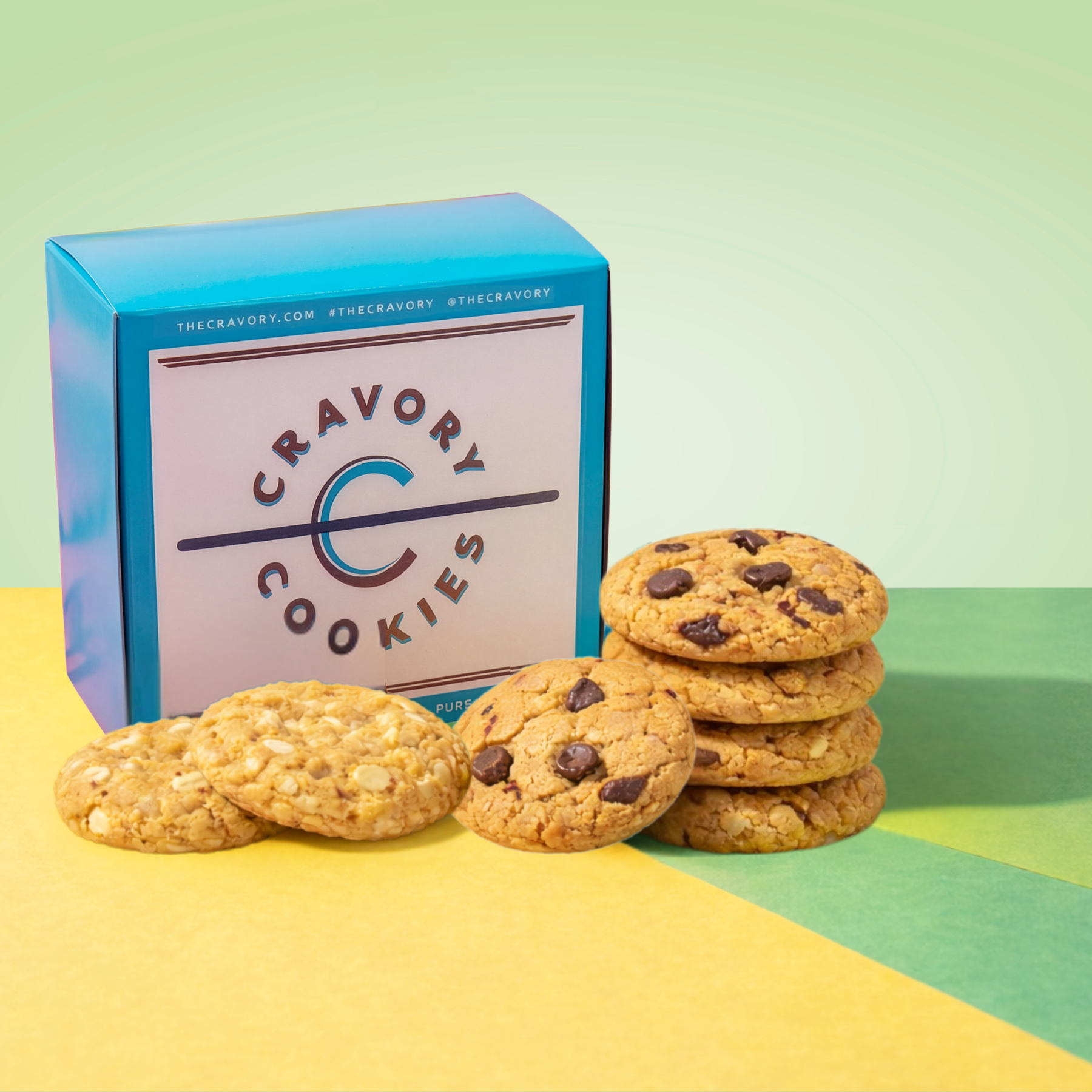 Stack of cookies with a Cravory Cookies box on a colorful background