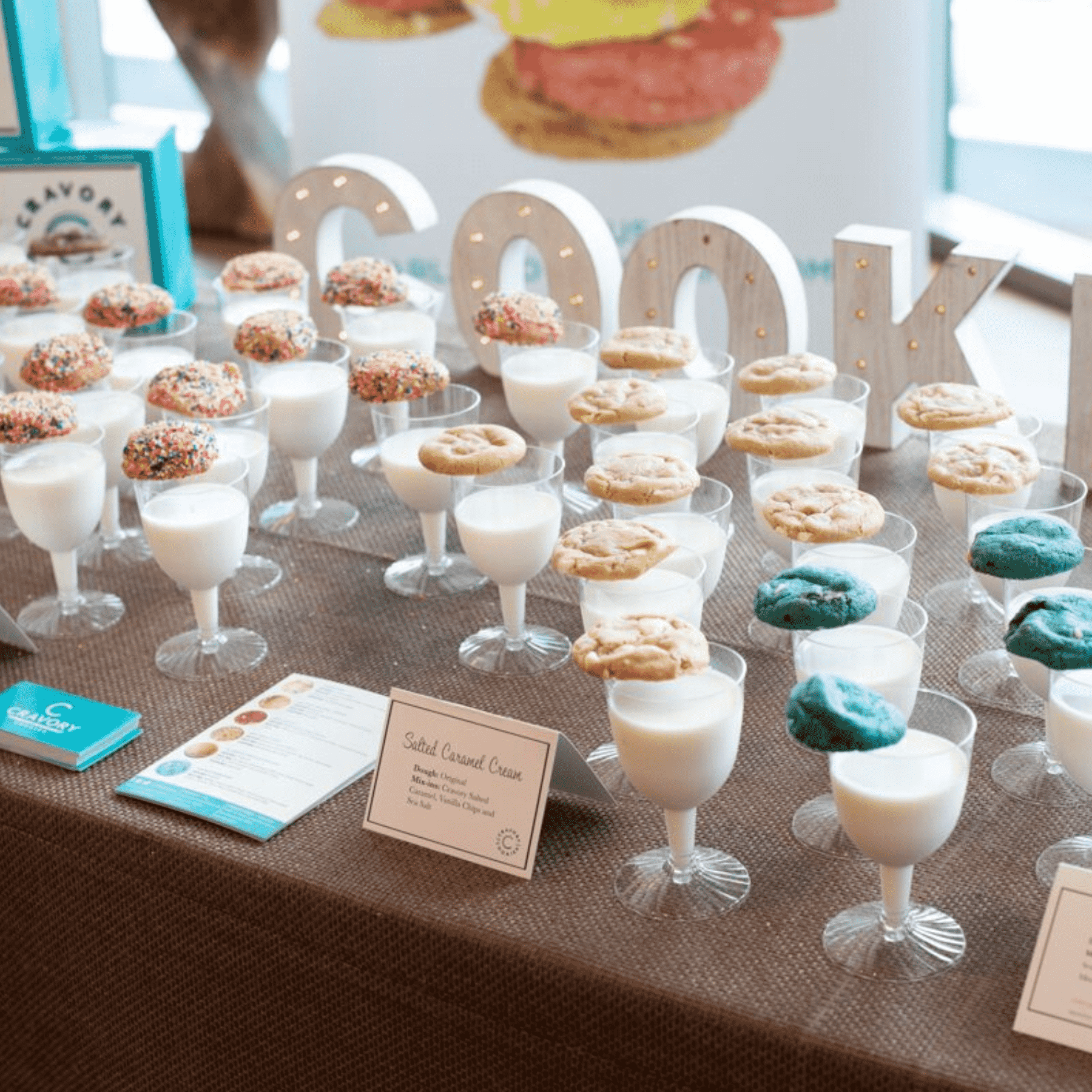 Wedding table with assorted cookies and glasses of milk