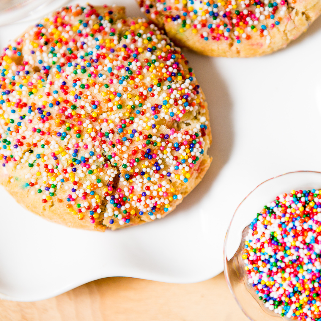Are Cookies A Good Birthday Gift? - Cookies covered in sprinkles placed on a white plate
