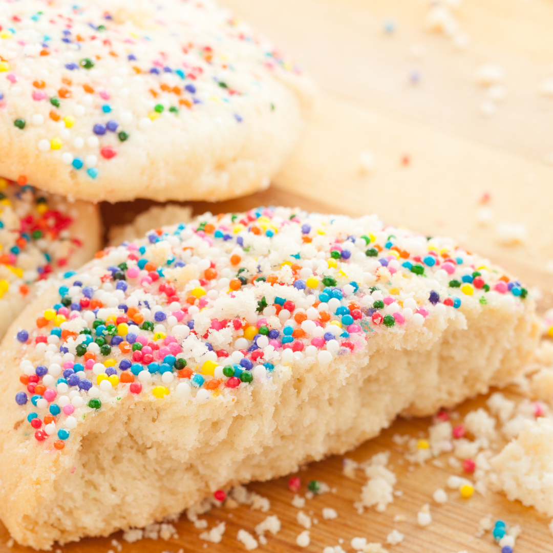 Keto Birthday Cake Cookies - half of a keto birthday cake cookie covered in sprinkles