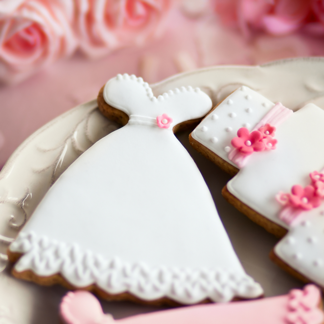Sweet Indulgences: How to Display Cookies at a Wedding - Cookies in the shape of a wedding dress on plate