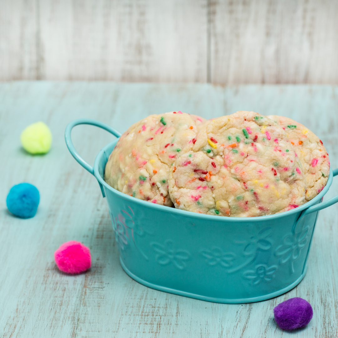 Cookies baked with sprinkles in blue metal basket