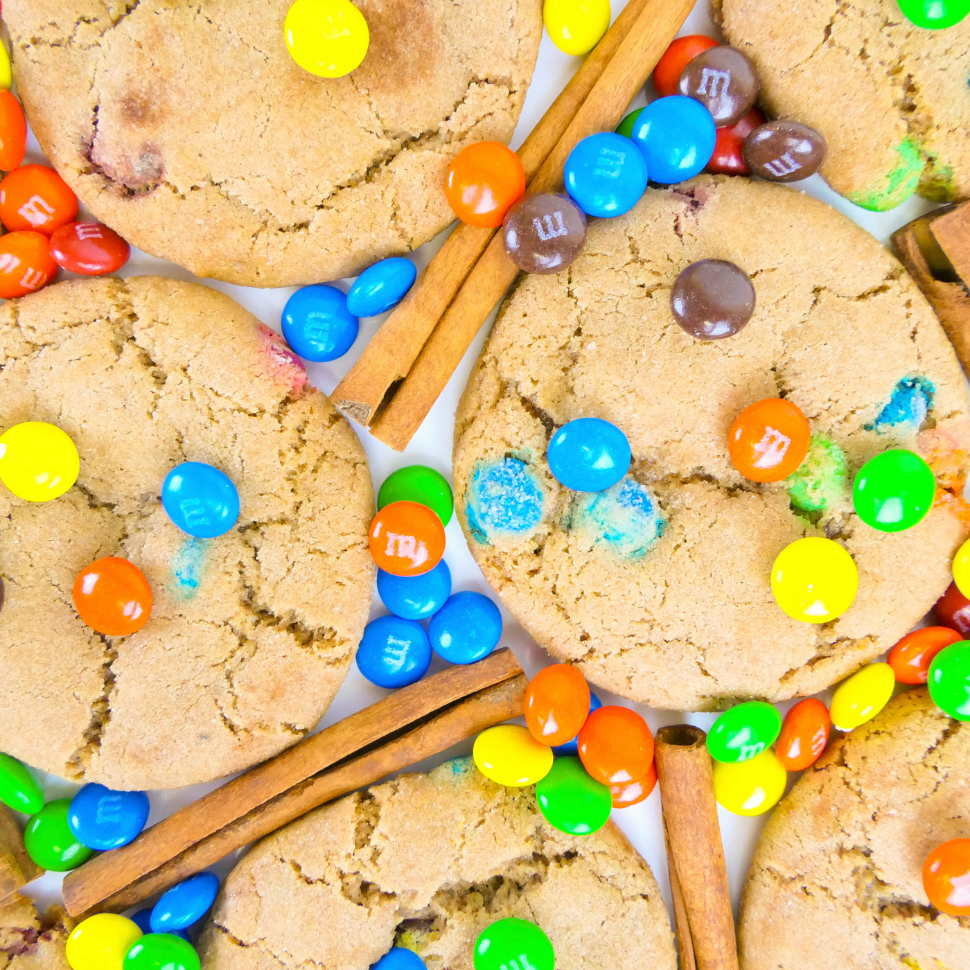 Cookies with m&m + cinnamon on table - Caramalized Snickerdoodle