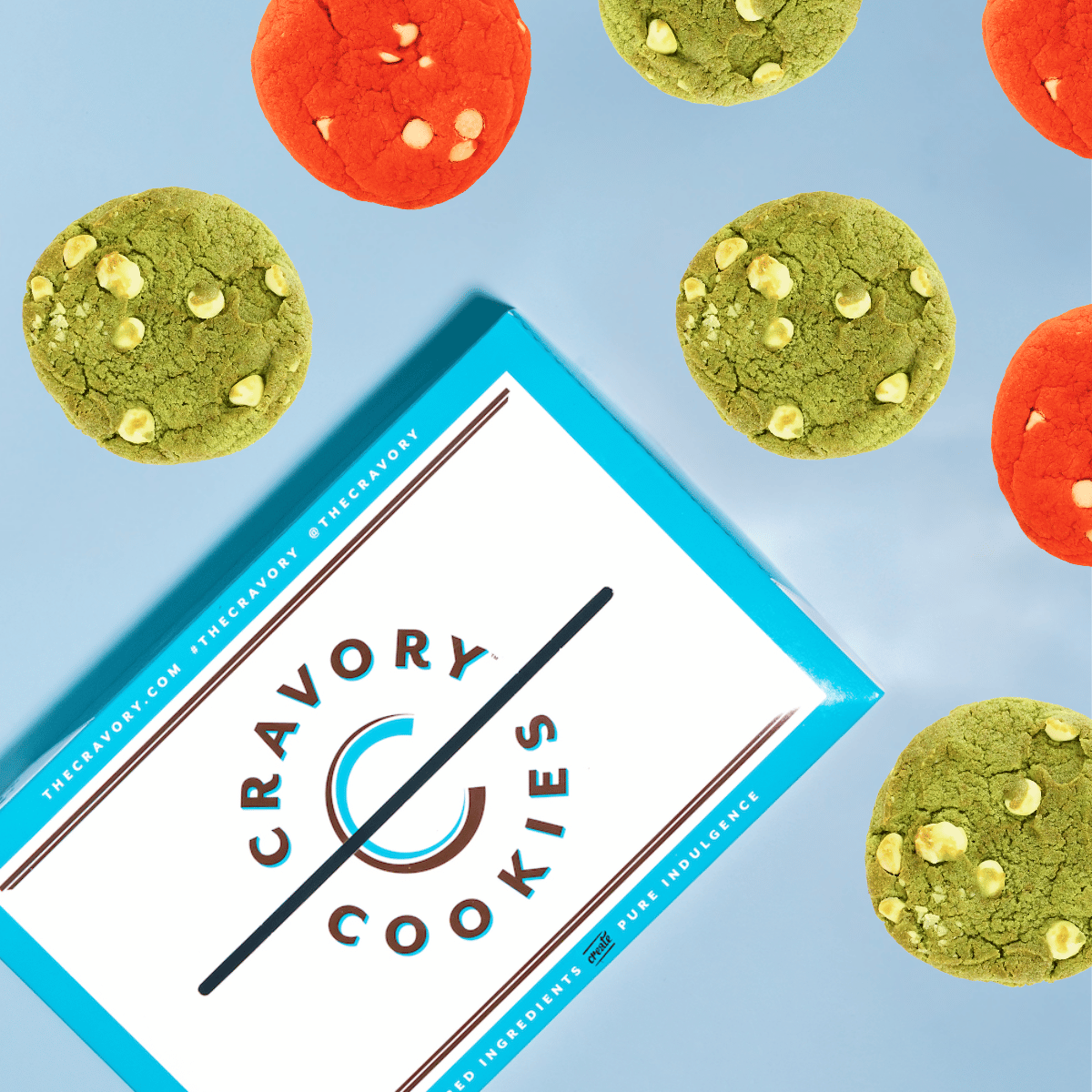 Box of Cravory Cookies with cookies around on a blue background