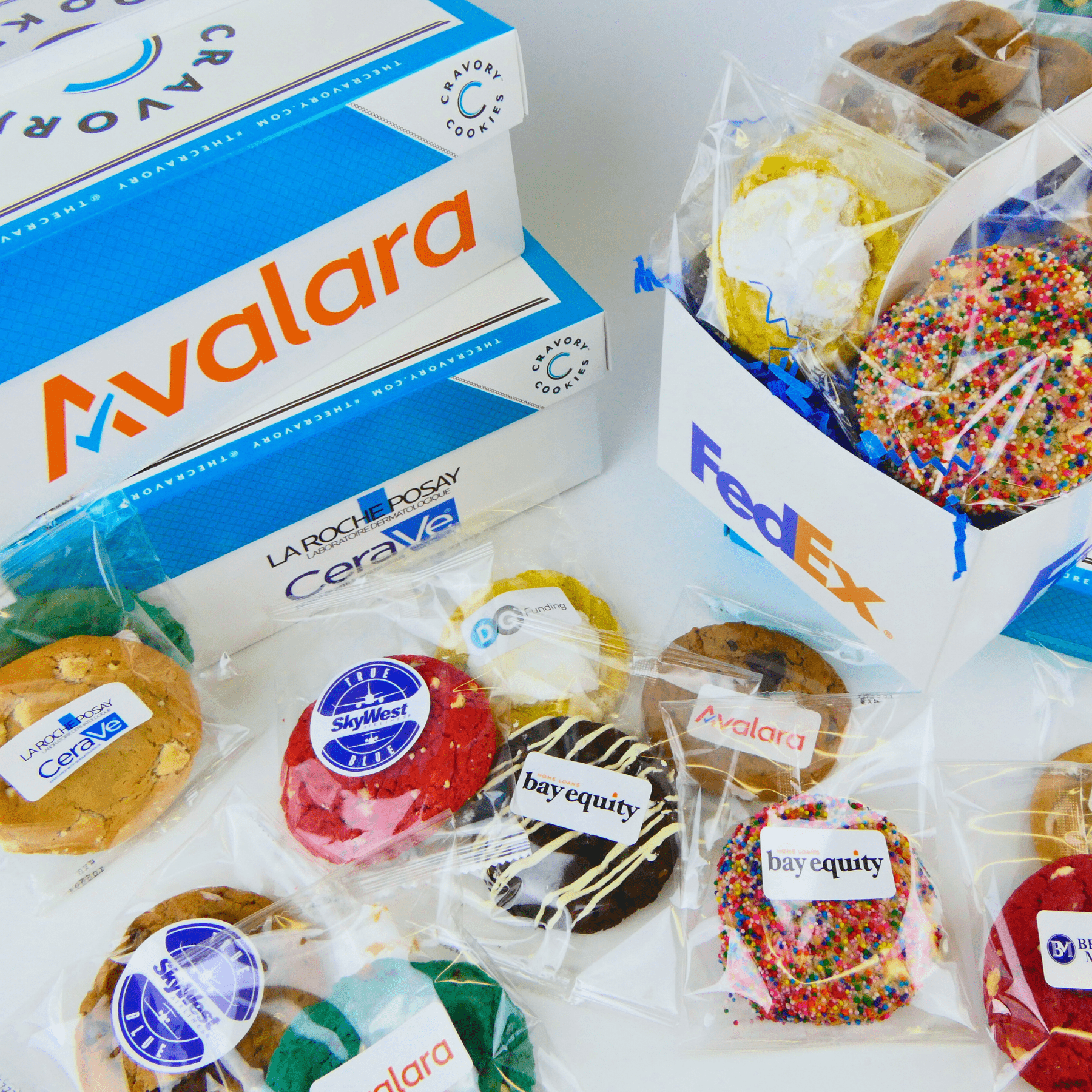 Assorted cookies individually wrapped with company logos