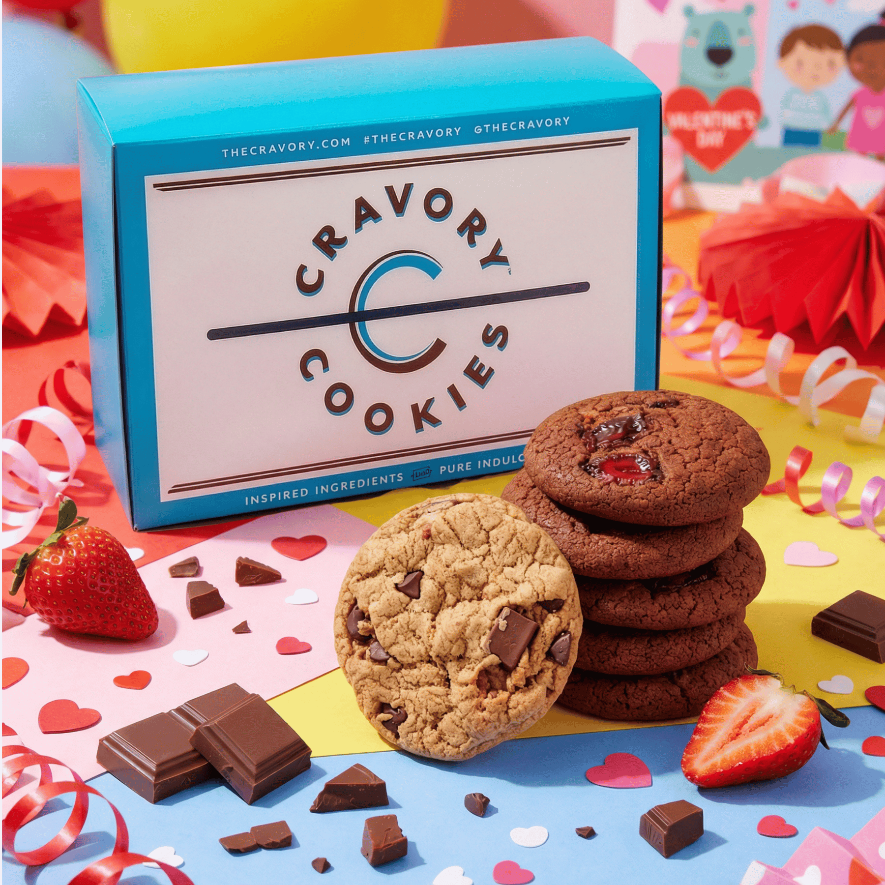 Box of  one-dozen February Mix Cravory Cookies with cookies and chocolate pieces on a colorful background