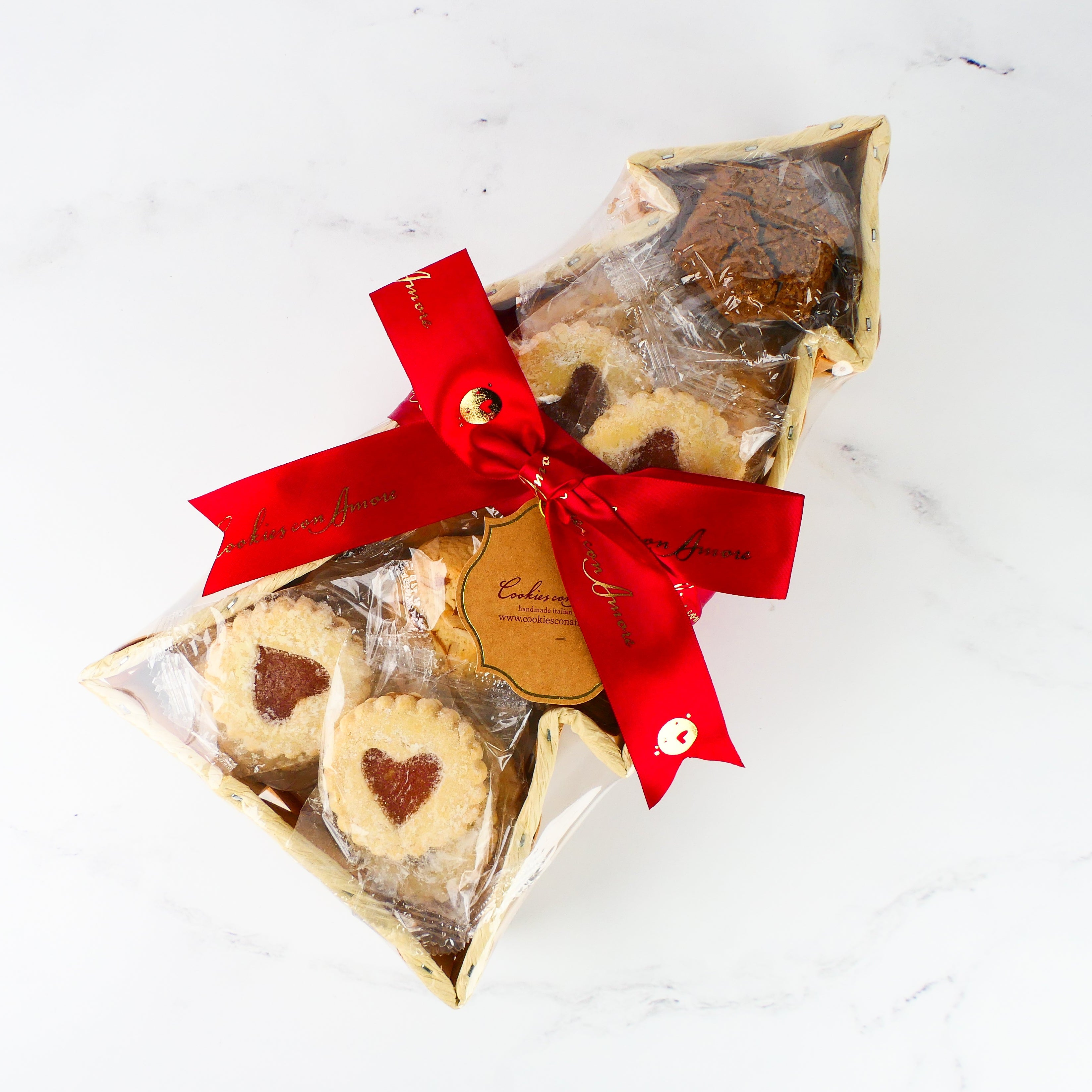 Packaged cookies with a red ribbon on a white background