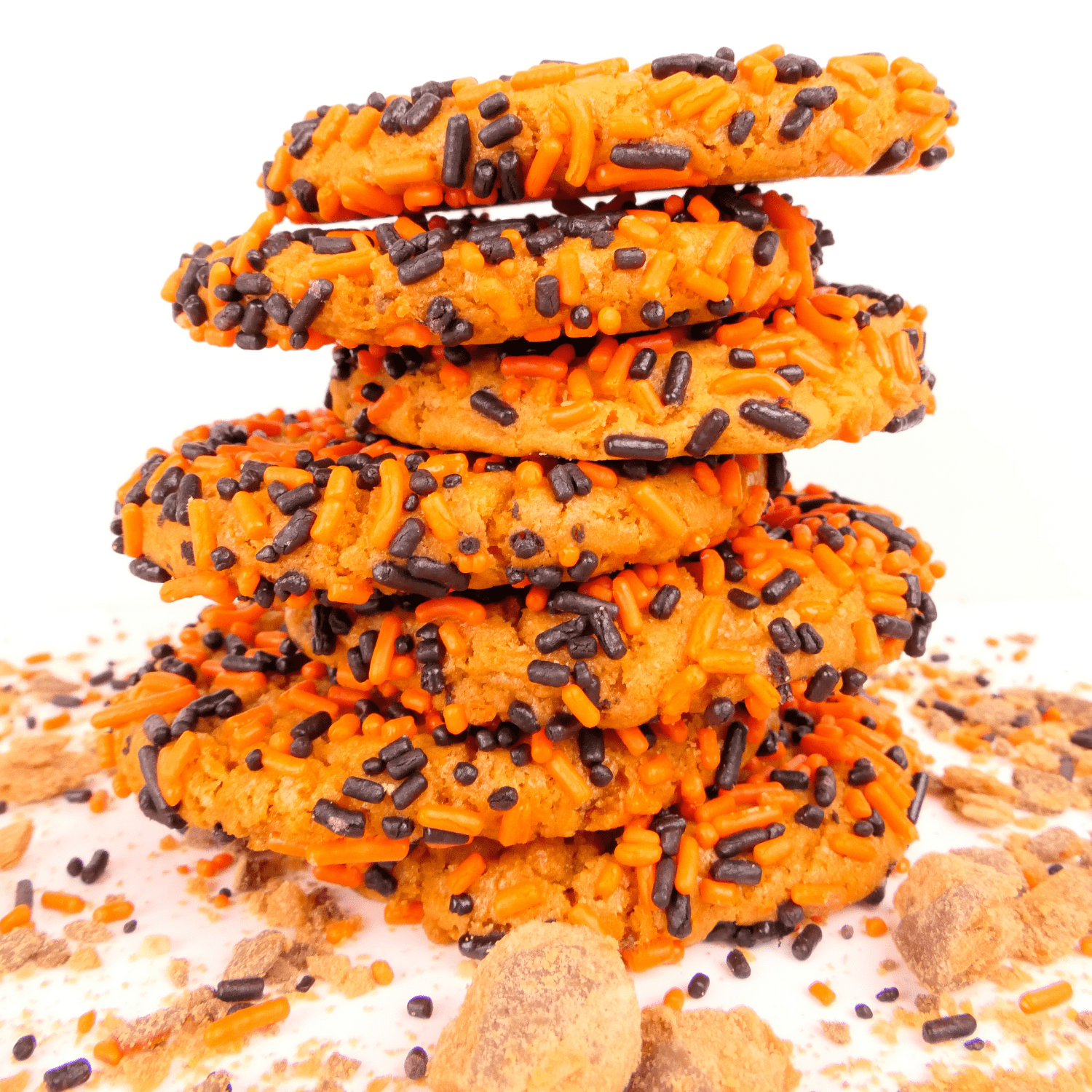 Jack o lantern cookies stacked on top of each other